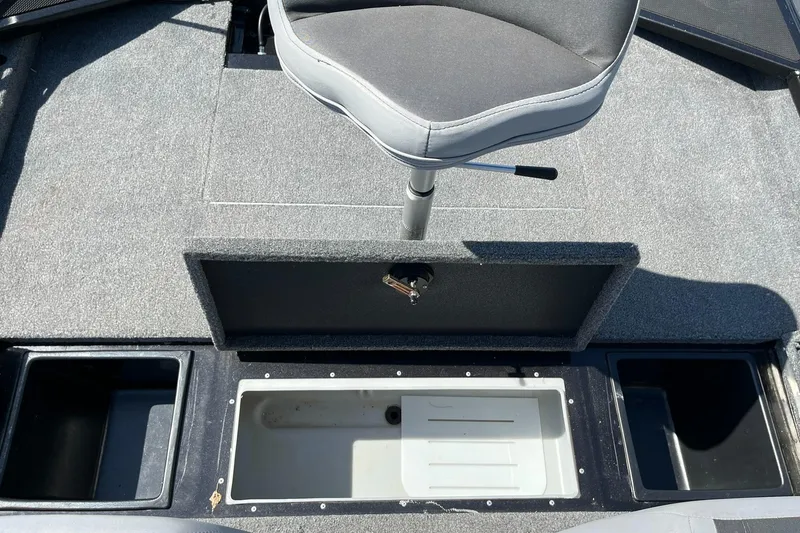 Slide: The Image of 2022 Alumacraft Pro 175 boat interior with seat and storage compartments. - 17