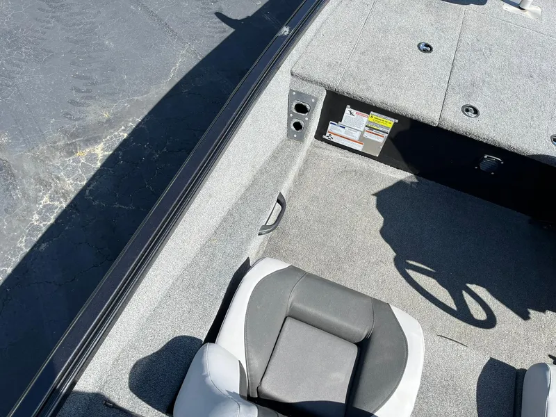 Slide: The Image of 2022 Alumacraft Pro 175 boat interior with gray carpet and seating. - 18