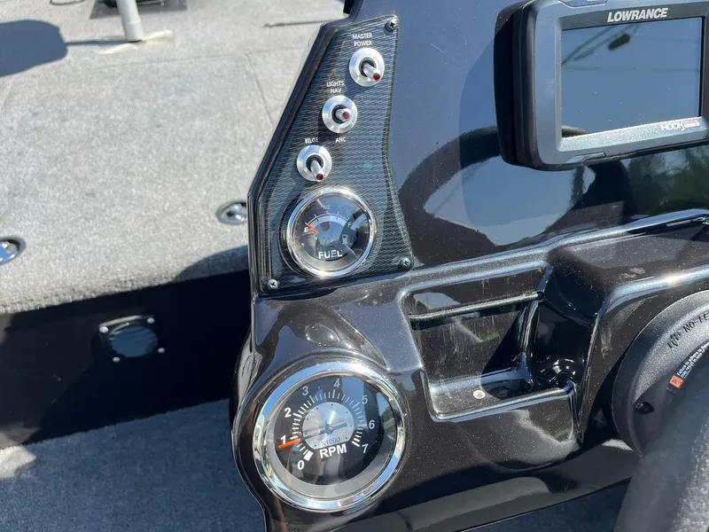 Slide: The Image of 2022 Alumacraft Pro 175 dashboard with fuel gauge, RPM meter, and Lowrance display. - 9