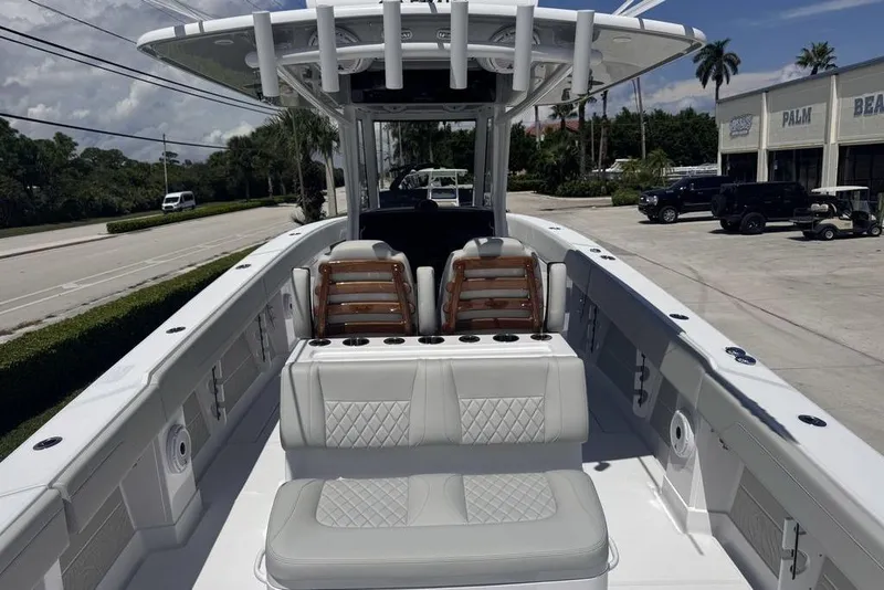 Slide: The Image of 2025 Jupiter 380 LS boat deck with luxurious seating and triple outboard engines. - 4