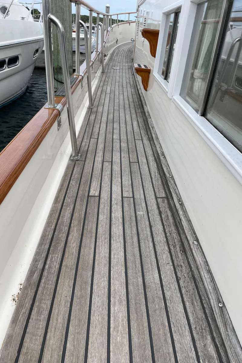 Slide: The Image of Teak deck of 1990 Grand Banks 42 Classic yacht with stainless steel railings. - 40