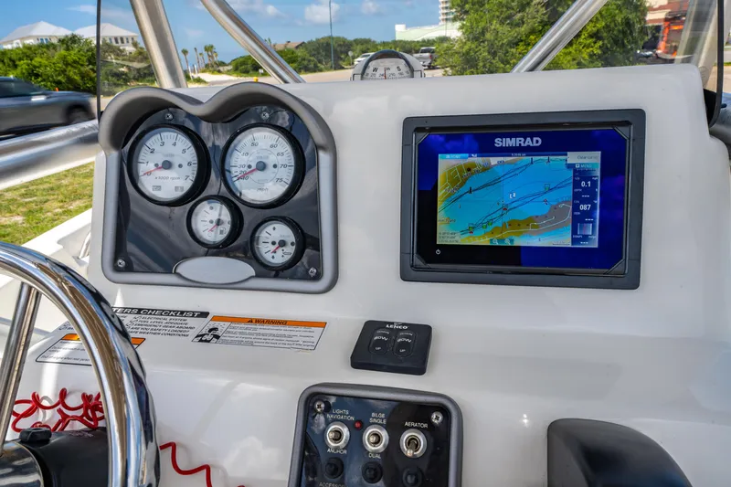 Slide: The Image of Dashboard of 2017 NauticStar 19XS boat with Simrad navigation display. - 15