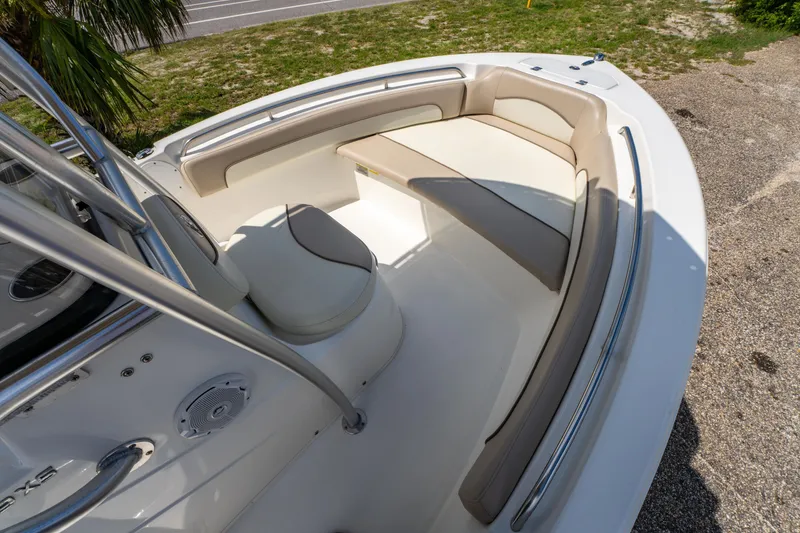 Slide: The Image of 2017 NauticStar 19XS boat interior with cushioned seating and stainless steel railings. - 16