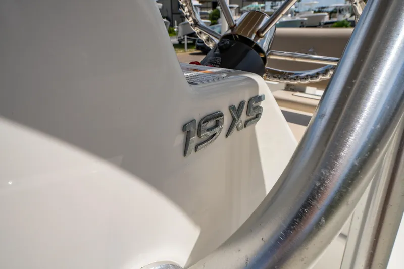 Slide: The Image of 2017 NauticStar 19XS boat console with steering wheel detail. - 19