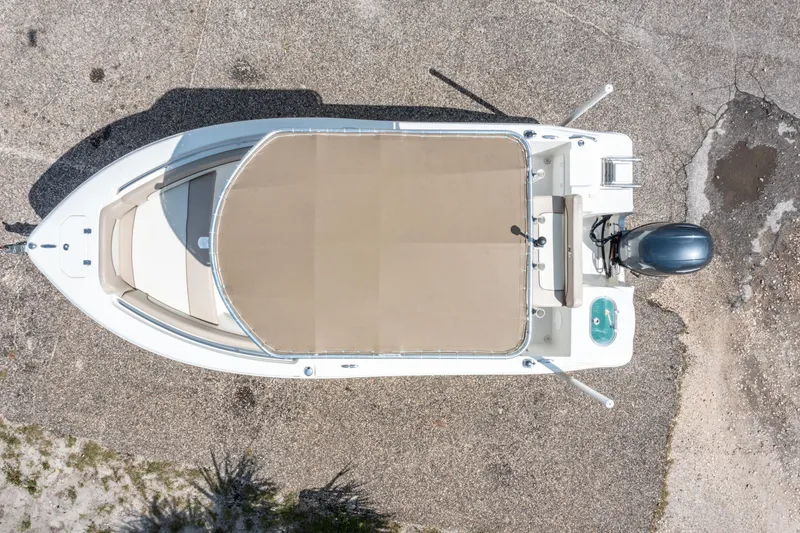 Slide: The Image of Top view of a 2017 NauticStar 19XS boat on a textured surface. - 23