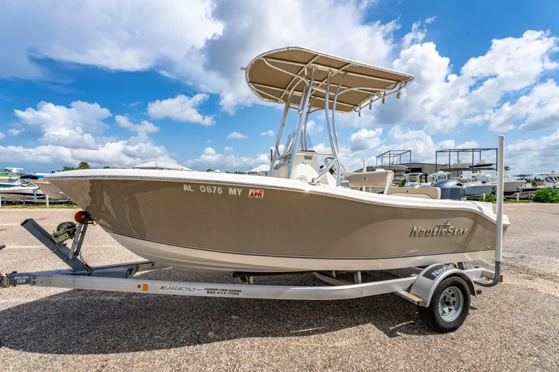 Slide: The Image of 2017 NauticStar 19XS boat on trailer under blue sky. - 6