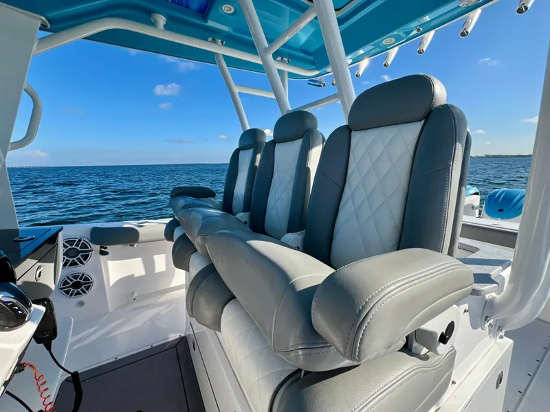 Slide: The Image of 2023 Everglades 365 Center Console boat interior with luxurious seating and ocean view. - 16