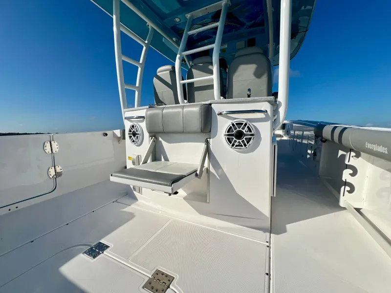 Slide: The Image of 2023 Everglades 365 Center Console boat interior with seating and speakers. - 19