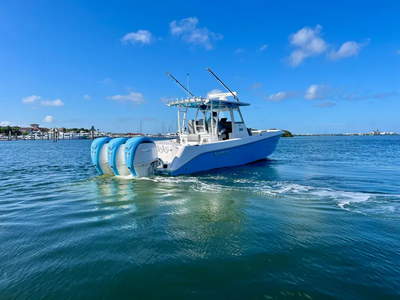 Slide: The Image of 2023 Everglades 365 Center Console boat cruising on a sunny day. - 30