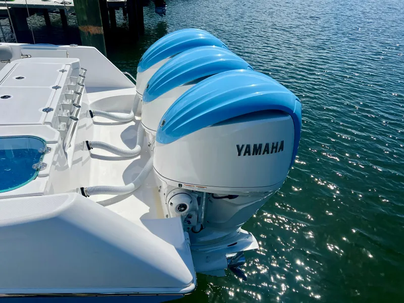 Slide: The Image of Triple Yamaha outboard engines on 2023 Everglades 365 Center Console boat. - 38