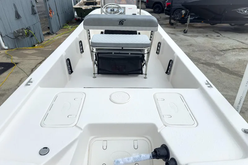 Slide: The Image of 2026 Carolina Skiff E20 JVX CC boat interior with seating and storage compartments. - 20