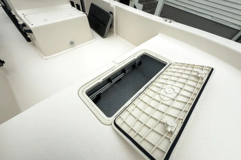 Slide: The Image of 2026 Carolina Skiff E20 JVX CC boat interior with open storage compartment. - 26