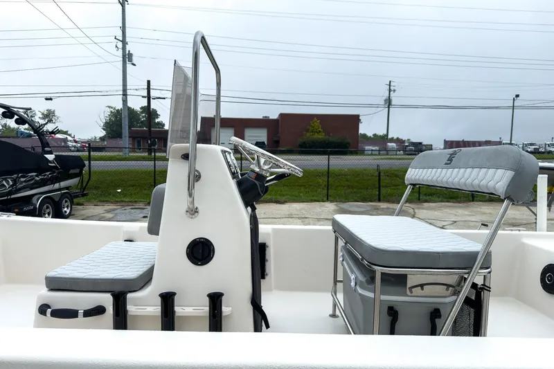 Slide: The Image of 2026 Carolina Skiff E20 JVX CC boat interior with seating and steering console. - 4