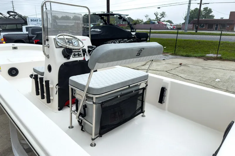 Slide: The Image of 2026 Carolina Skiff E20 JVX CC boat interior with steering console and seating. - 8