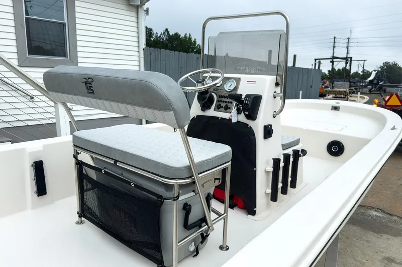 Slide: The Image of 2026 Carolina Skiff E20 JVX CC boat interior with steering console and seating. - 9