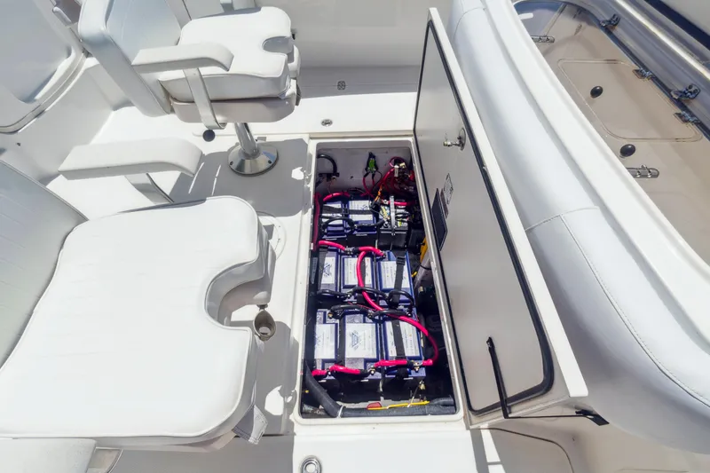 Slide: The Image of 2008 Fountain 38 Sport Cruiser battery compartment with seating area. - 4
