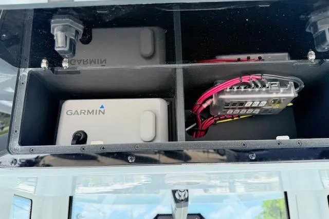 Slide: The Image of 2025 Tidewater 272 CC Adventure electronics compartment with Garmin devices and wiring. - 14