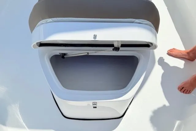 Slide: The Image of Open storage compartment on 2025 Tidewater 272 CC Adventure boat deck. - 18