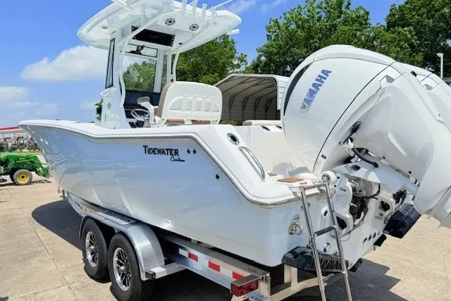 Slide: The Image of 2025 Tidewater 272 CC Adventure boat on trailer, featuring Yamaha outboard motor. - 24