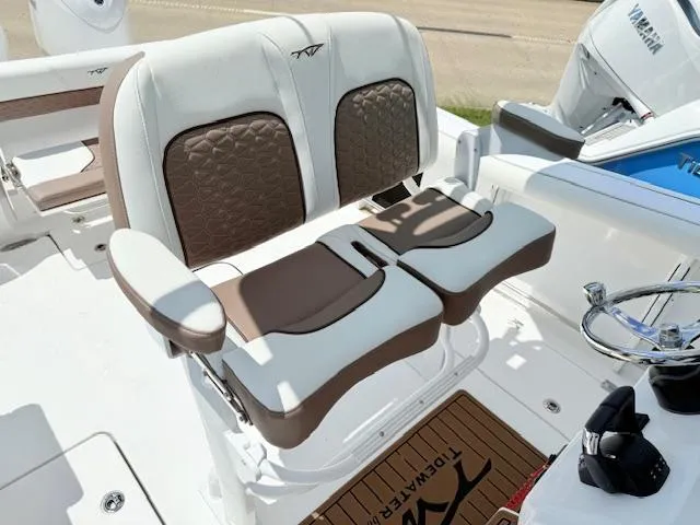 Slide: The Image of 2025 Tidewater 272 CC Adventure boat with dual outboard engines on a trailer. - 4
