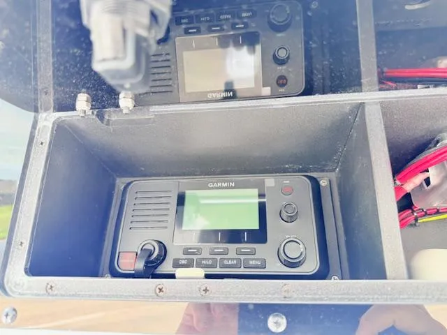 Slide: The Image of 2025 Tidewater 272 CC Adventure boat with dual engines and comfortable seating. - 6