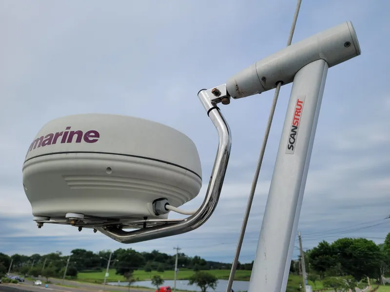 Slide: The Image of Winch on 1985 Bristol 38.8 sailboat deck with wooden handle and rigging. - 13