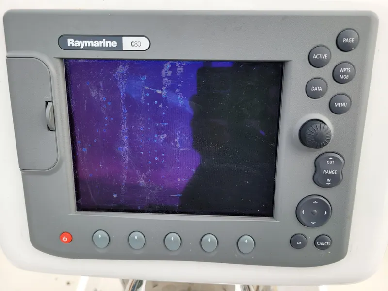 Slide: The Image of 1985 Bristol 38.8 sailboat cockpit with navigation instruments and green ropes. - 16