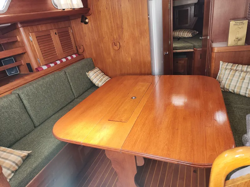 Slide: The Image of Interior of 1985 Bristol 38.8 sailboat with wooden furnishings and navigation equipment. - 21