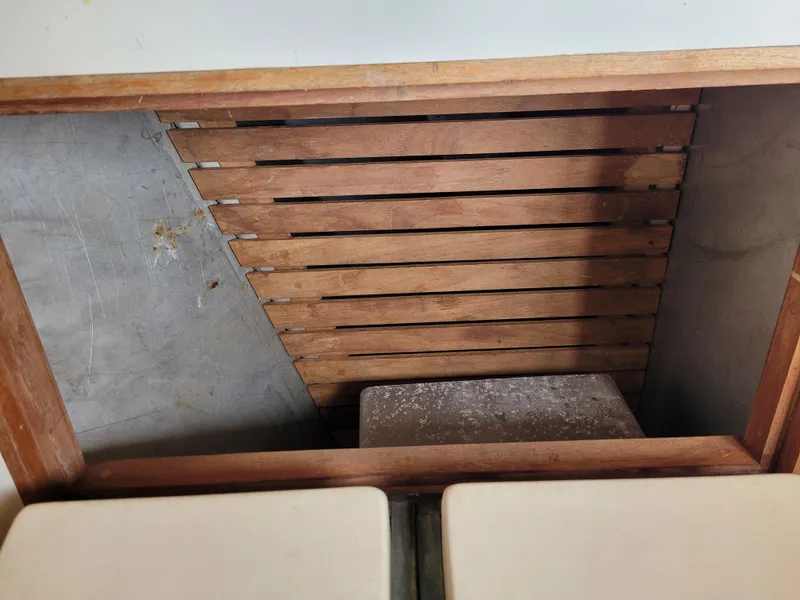 Slide: The Image of 1985 Bristol 38.8 yacht kitchen with wooden cabinetry, stove, and dual sink. - 27