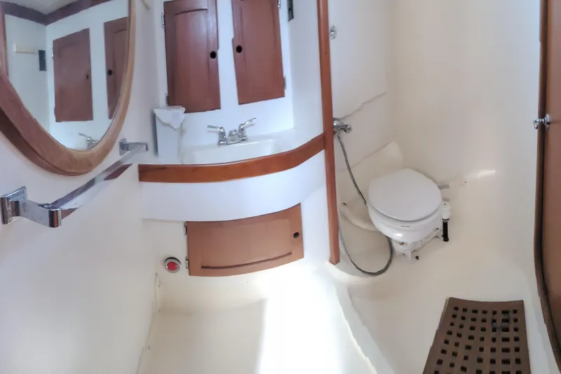 Slide: The Image of Interior of 1985 Bristol 38.8 yacht with wooden cabinetry and cushioned seating. - 34