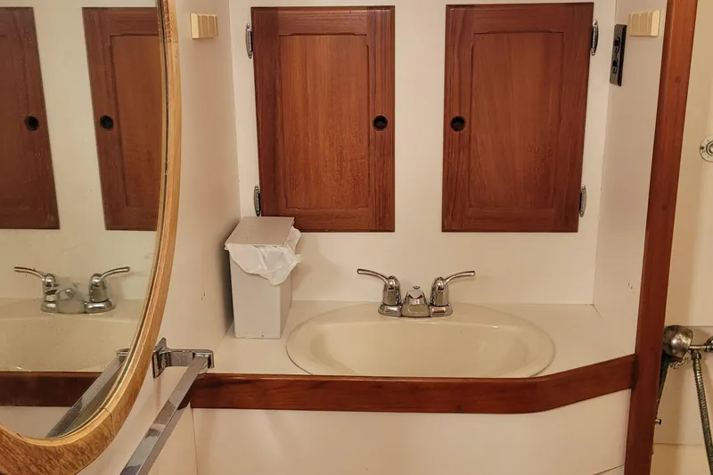 Slide: The Image of Interior of 1985 Bristol 38.8 sailboat with wood paneling and cozy cabin space. - 35