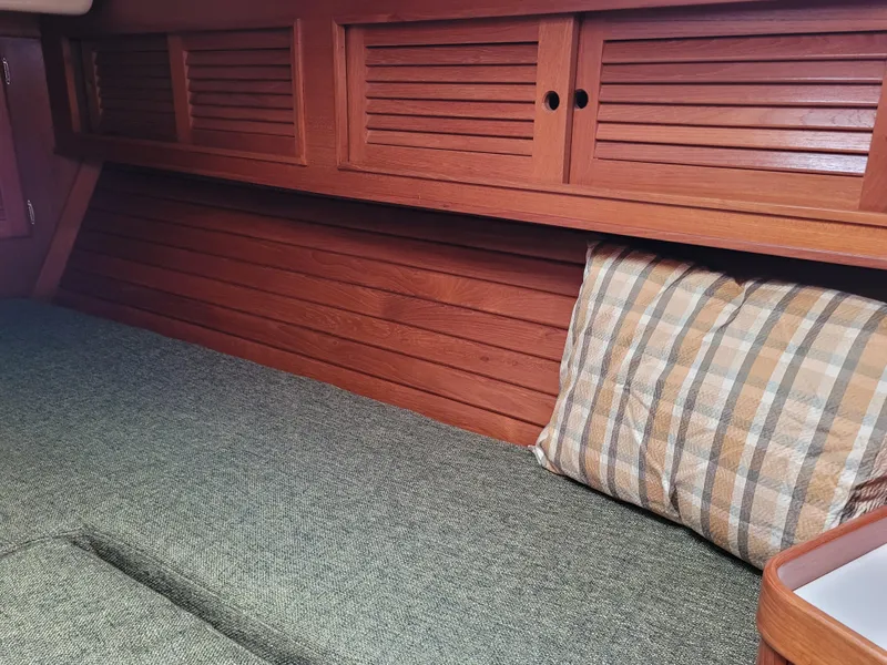 Slide: The Image of 1985 Bristol 38.8 yacht bathroom with wooden cabinets and round mirror. - 39