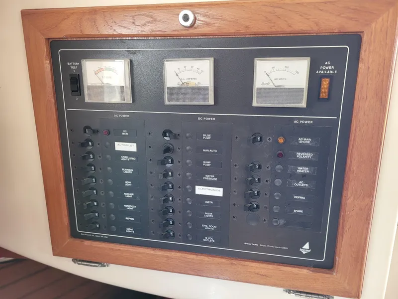 Slide: The Image of Interior of 1985 Bristol 38.8 sailboat with wooden furnishings and cozy seating area. - 43