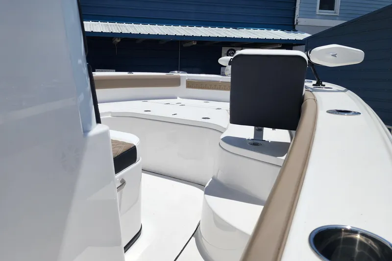 Slide: The Image of 2026 Blackfin 242HB boat interior with seating and cup holders. - 12