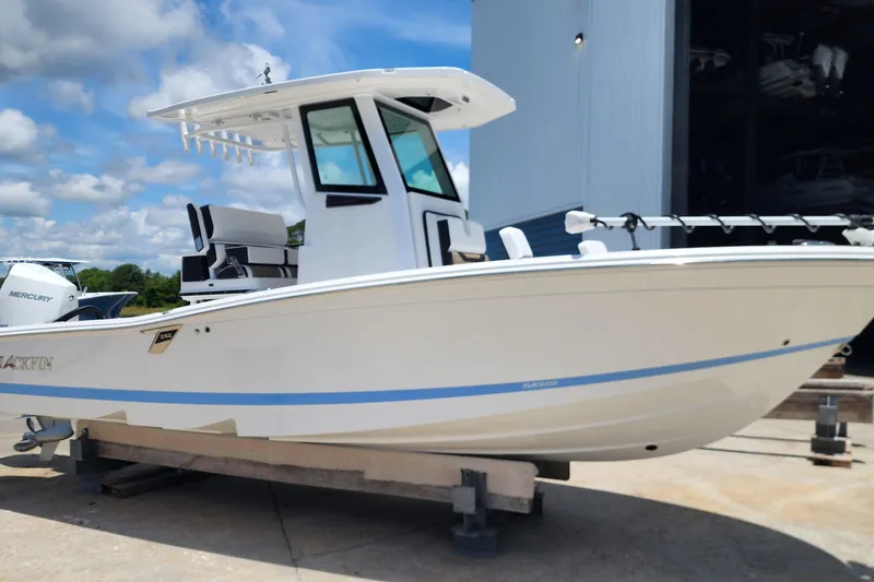 Slide: The Image of 2026 Blackfin 242HB boat on display, featuring sleek design and modern amenities. - 7