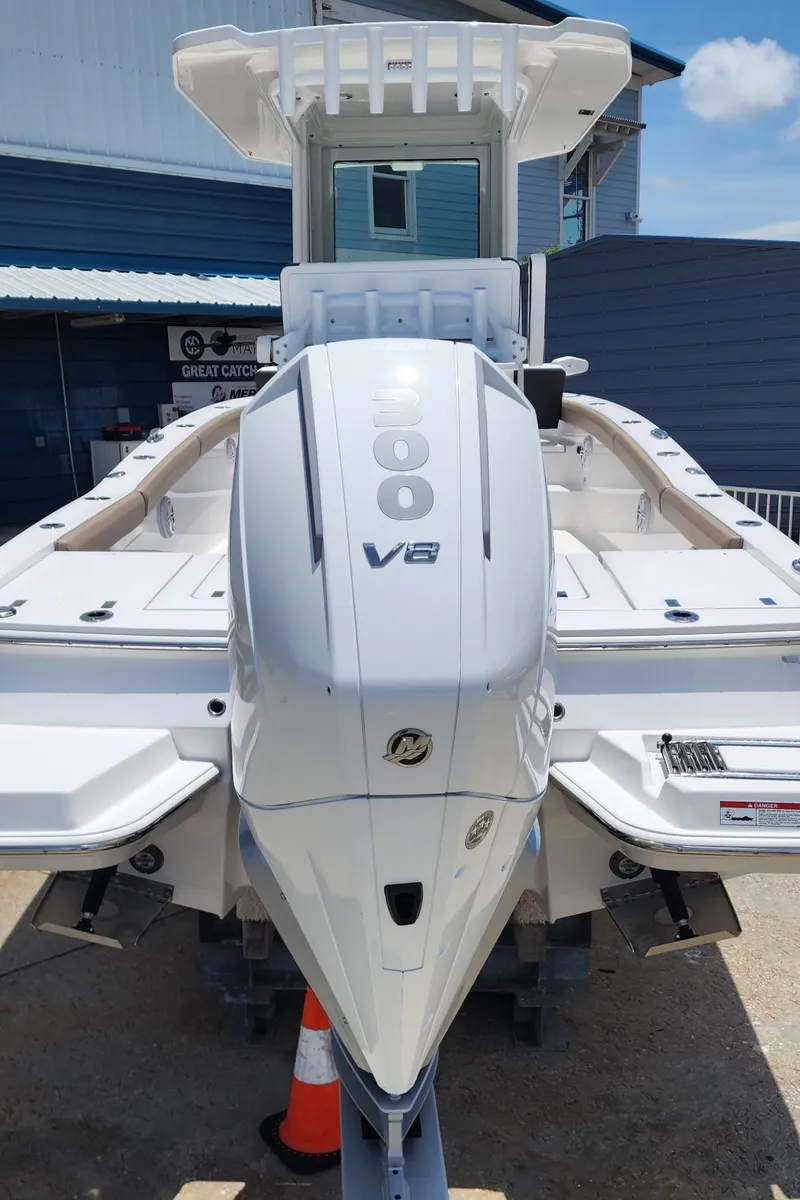 Slide: The Image of 2026 Blackfin 242HB boat with powerful V8 engine, displayed outdoors. - 8