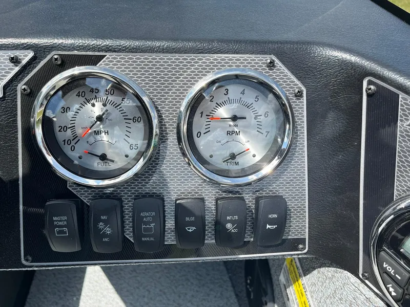 Slide: The Image of Dashboard of 2026 Lund 1675 Adventure SS boat with speedometer and RPM gauges. - 17