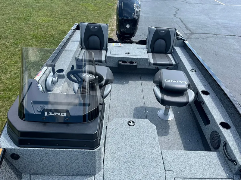 Slide: The Image of 2026 Lund 1675 Adventure SS boat interior with seating and steering console. - 6