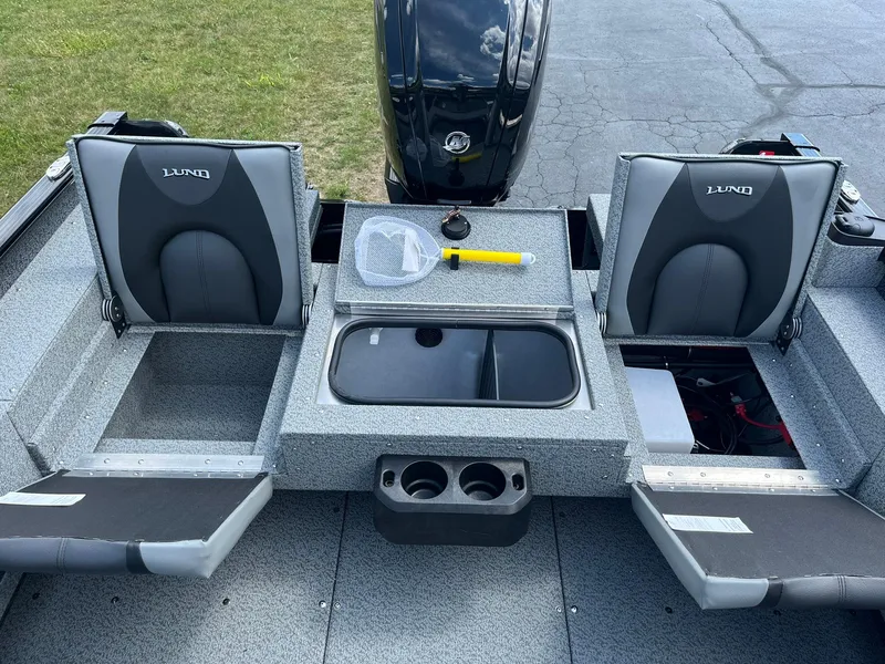 Slide: The Image of 2026 Lund 1675 Adventure SS boat interior with seating and storage compartments. - 9