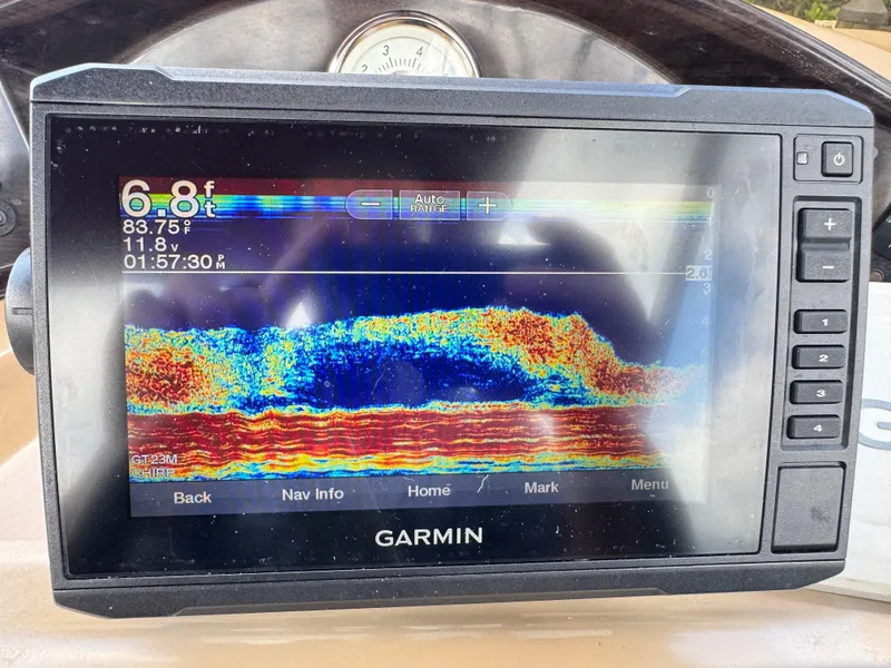 Slide: The Image of Garmin fishfinder display on 2014 Harris FloteBote Cruiser 200, showing depth and temperature. - 13