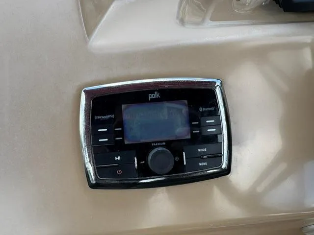 Slide: The Image of Polk audio system on 2014 Harris FloteBote Cruiser 200 boat dashboard. - 14