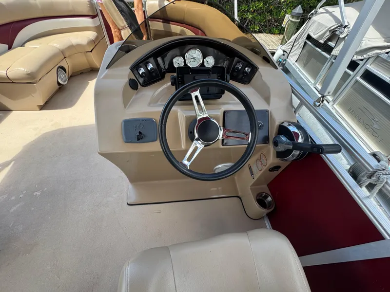 Slide: The Image of 2014 Harris FloteBote Cruiser 200 dashboard with steering wheel and gauges. - 5