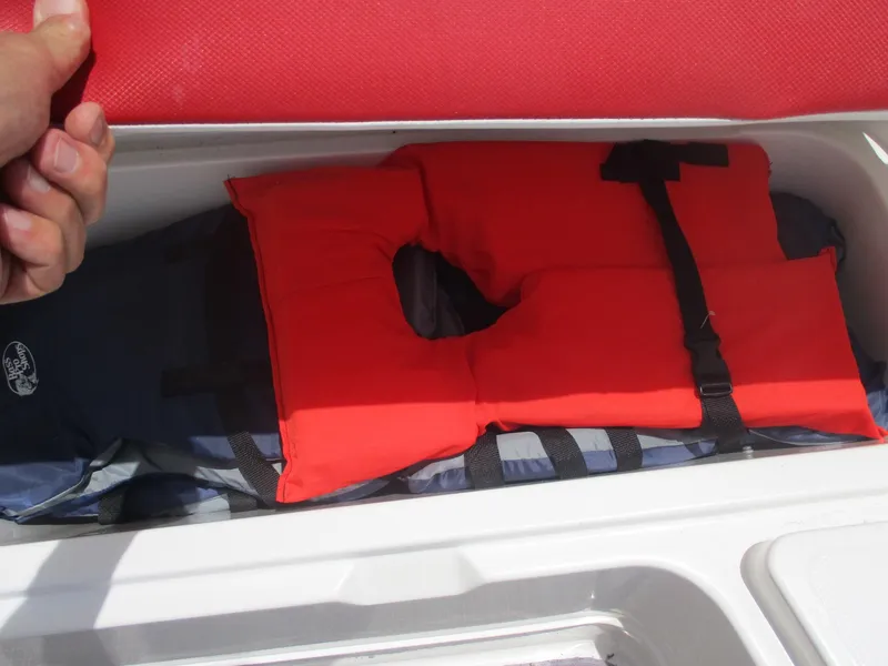 Slide: The Image of Storage compartment in 2019 Tahoe 2150 boat with life jackets. - 10