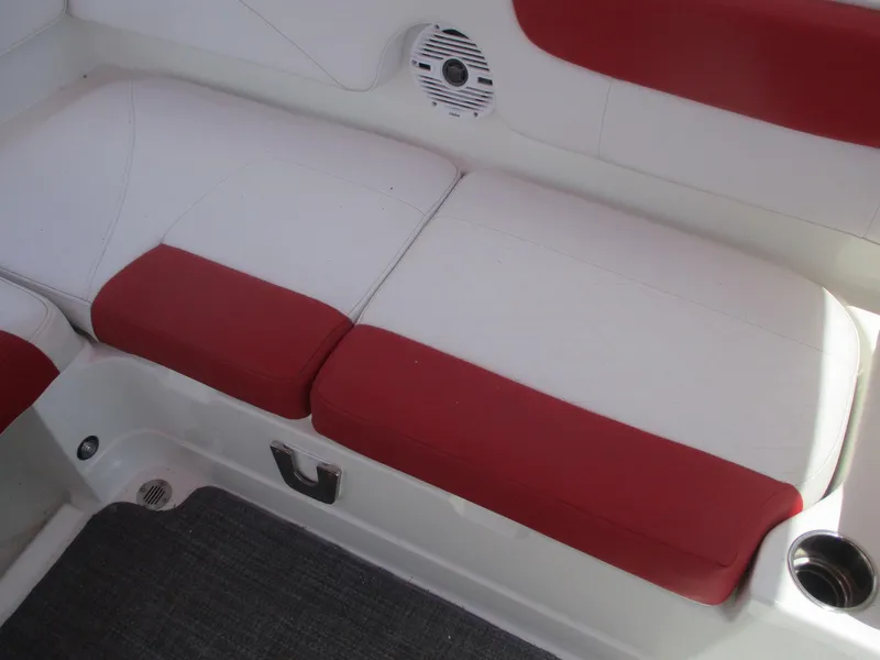 Slide: The Image of 2019 Tahoe 2150 boat interior with red and white seating. - 12