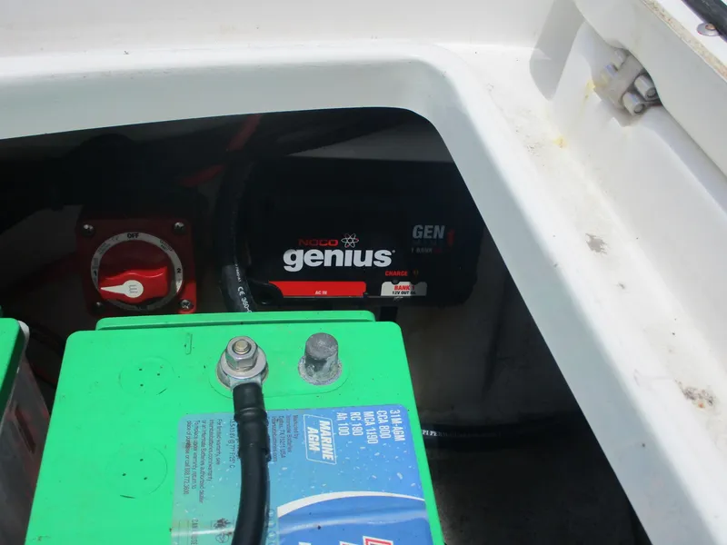 Slide: The Image of Battery compartment of a 2019 Tahoe 2150 with NOCO Genius charger. - 23