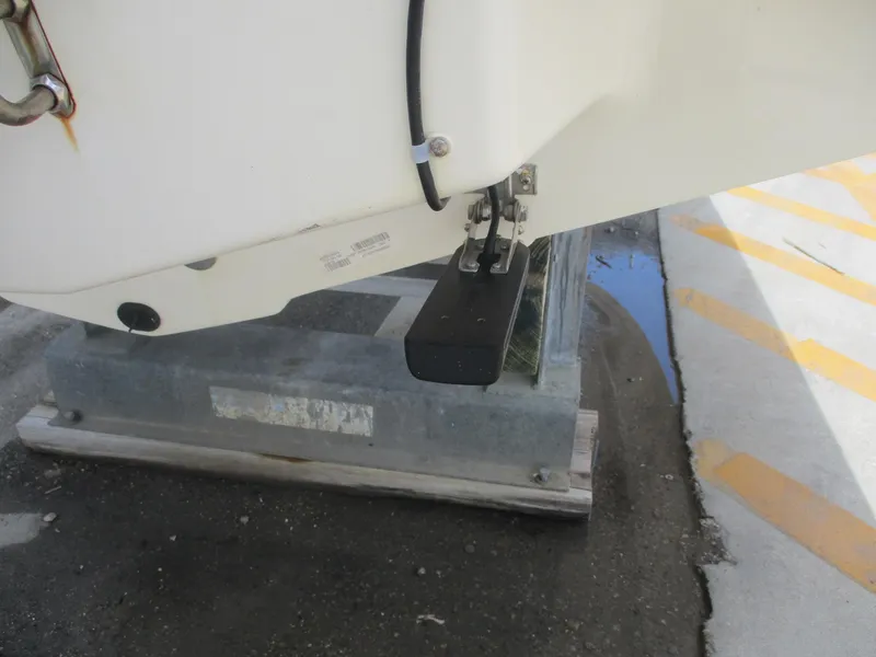 Slide: The Image of 2019 Tahoe 2150 boat on a stand, showing hull and hardware details. - 29