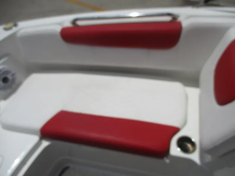 Slide: The Image of 2019 Tahoe 2150 boat interior with red and white seating. - 3