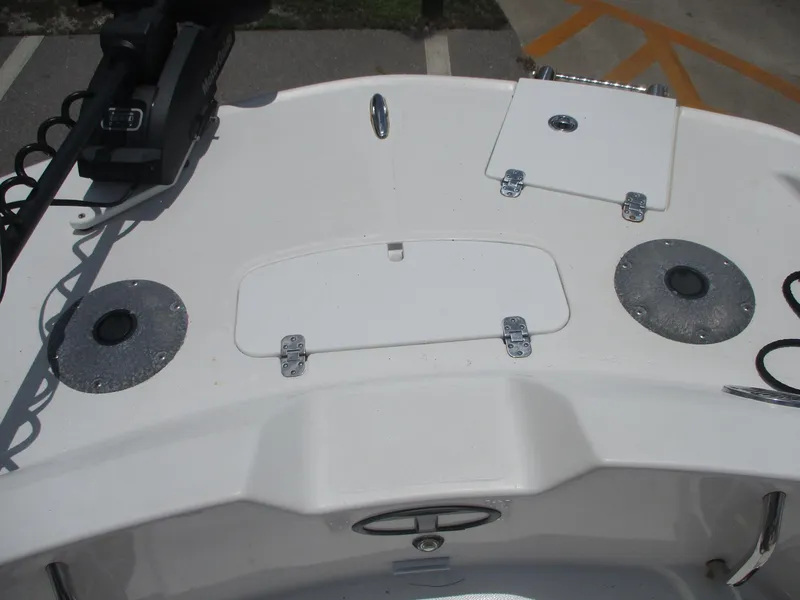 Slide: The Image of 2019 Tahoe 2150 boat deck with storage compartments and motor mount. - 6