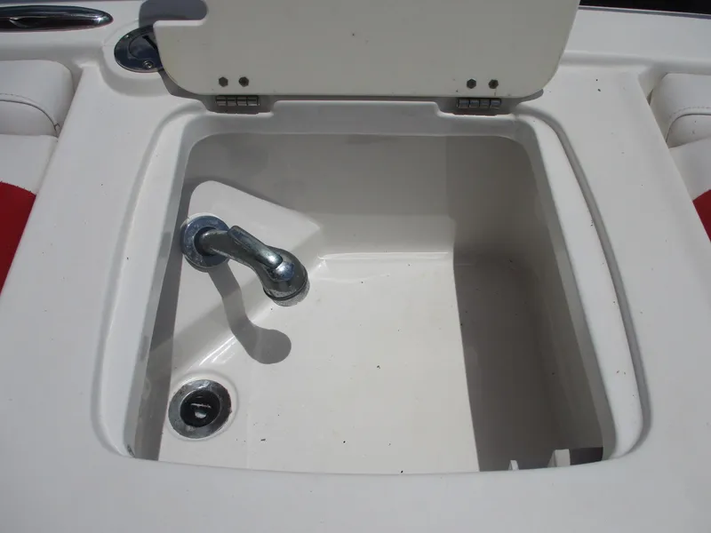 Slide: The Image of 2019 Tahoe 2150 boat sink with faucet and open lid. - 8