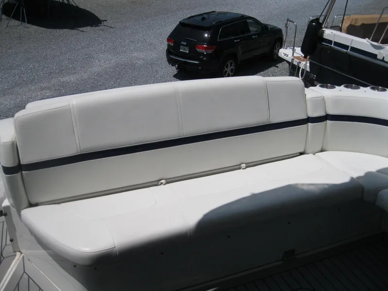 Slide: The Image of 2017 Formula 45 Yacht seating area with white upholstery and cup holders. - 16